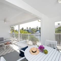 Snug Harbour View #9 – 2BR/2BA Canal Front Condo by Seven Mile Beach