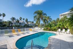 Snug Harbour View #6 – 1BR Canal Front Condo by Seven Mile Beach
