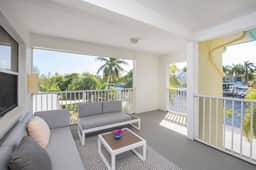 Snug Harbour View #7 – 2BR Canal Front Condo by Seven Mile Beach