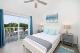 Summertime Suites #49 – Cozy 1BR West Bay Retreat with Pool