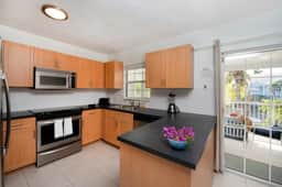 Snug Harbour View #7 – 2BR Canal Front Condo by Seven Mile Beach - Image 5