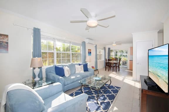 Snug Harbour View #1 – 1BR Canal‑Front Condo by Seven Mile Beach - Image 1