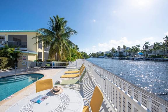 Snug Harbour View #5 – 1BR Canal Front Condo by Seven Mile Beach - Image 1