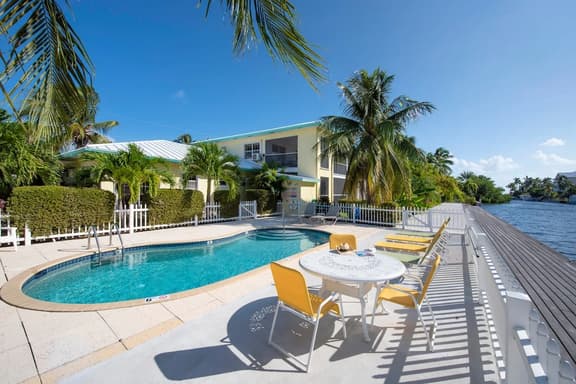 Snug Harbour View #4 – 1BR Canal Front Condo by Seven Mile Beach - Image 1