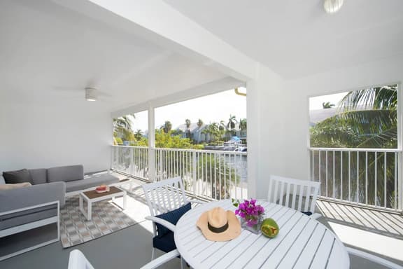 Snug Harbour View #9 – 2BR/2BA Canal Front Condo by Seven Mile Beach - Image 1