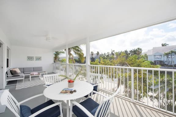 Snug Harbour View #8 – 2BR/2BA Canal Front Condo by Seven Mile Beach - Image 1
