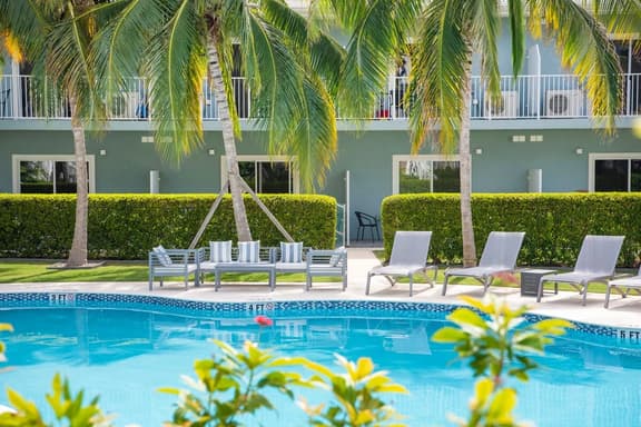 Summertime Suites #49 – Cozy 1BR West Bay Retreat with Pool - Image 1